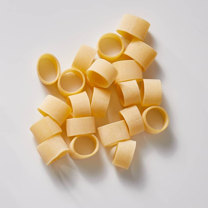 Calamari pasta on a white surface.