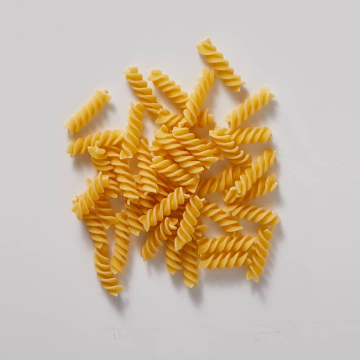 fusilli on a white surface
