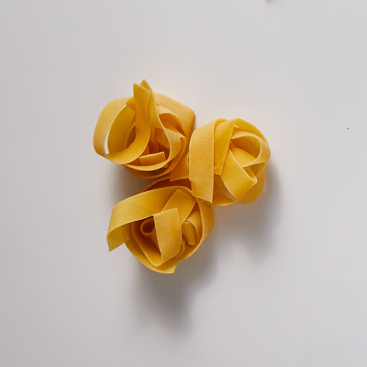 pappardelle on a white surface.