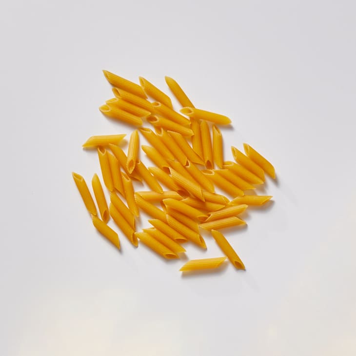 penne on a white surface.