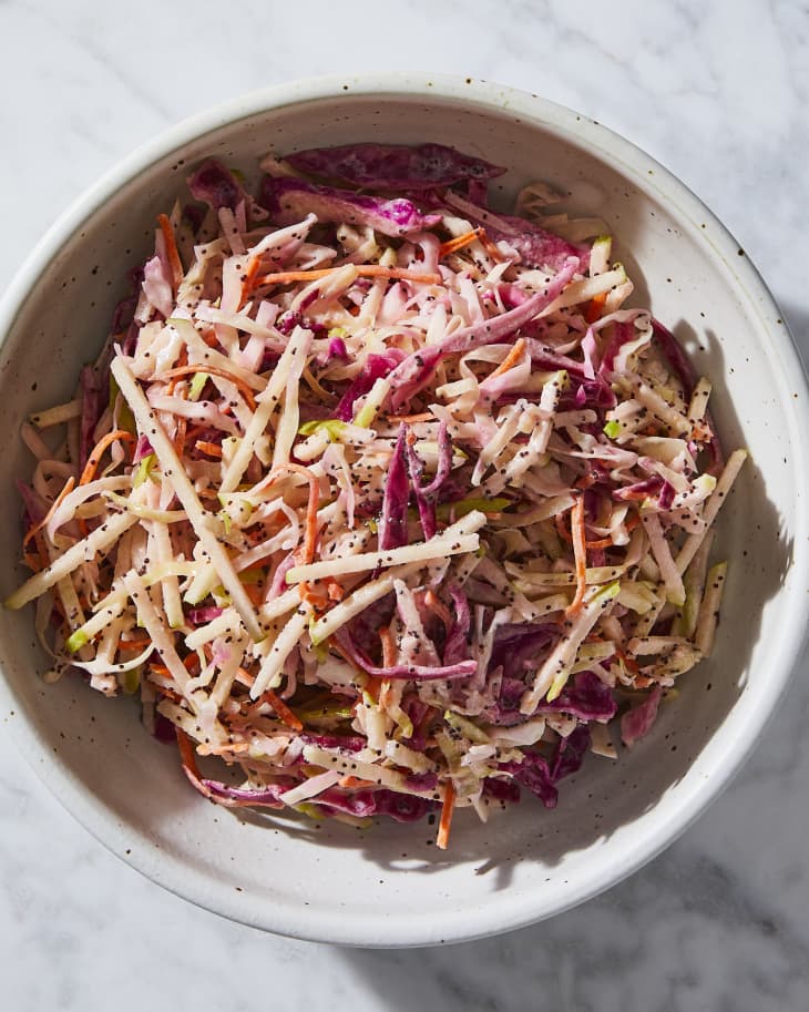 Damn Delicious red cabbage coleslaw in ceramic bowl.