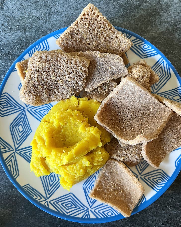 Tsiona Foods Injera Crisps on plate with dip