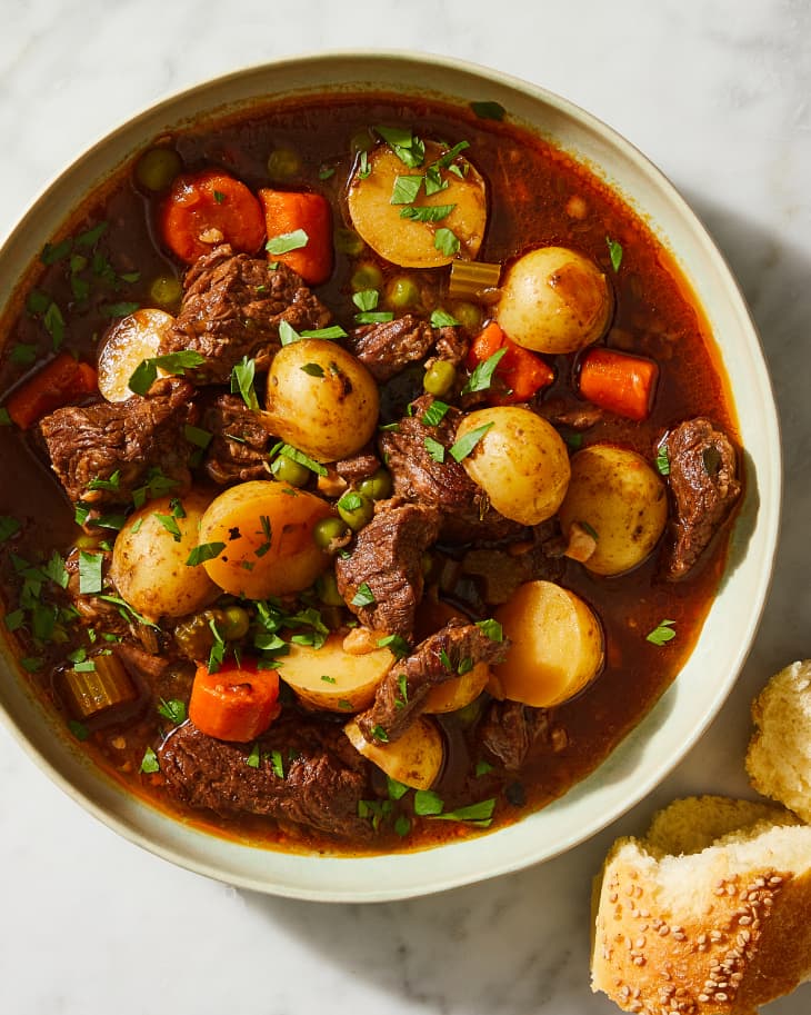 beef stew in a bowl with bread
