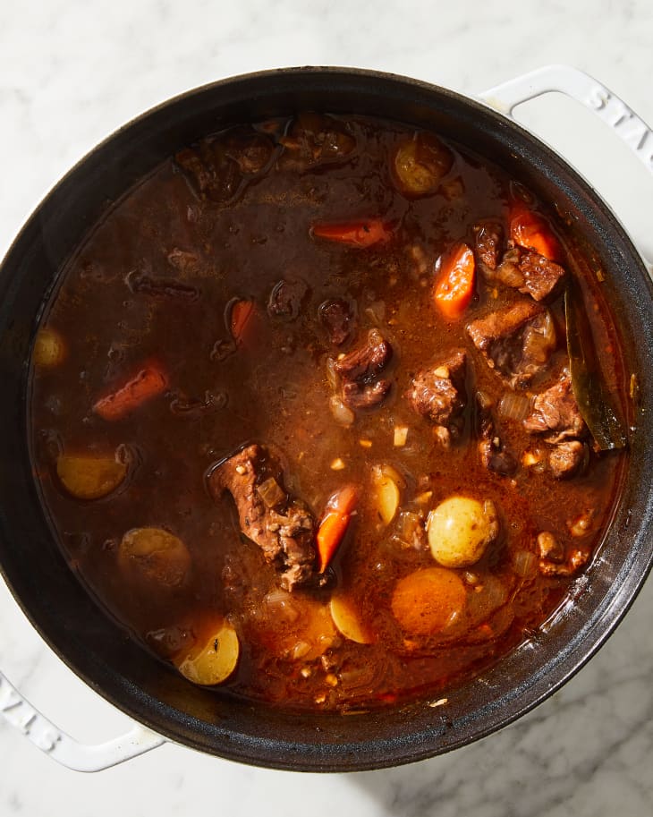 beef stew in a pot on marble