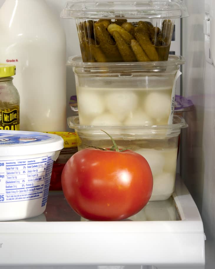 shot of tomato on a shelf in the fridge