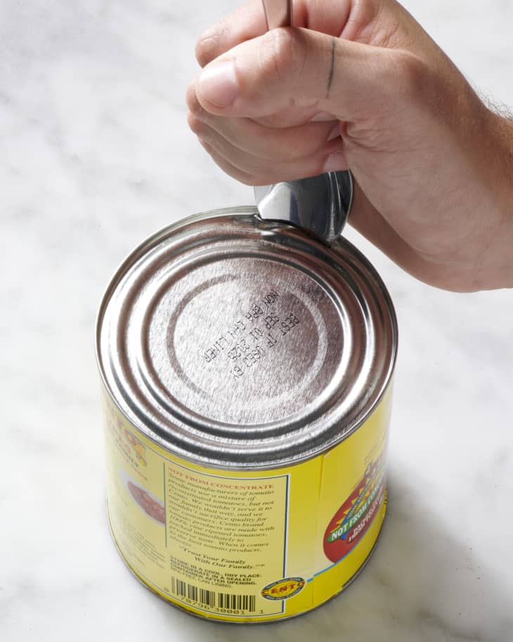 https://cdn.apartmenttherapy.info/image/upload/f_auto,q_auto:eco,w_730/k%2FPhoto%2FSeries%2F2023-09-how-to-open-a-can-without-a-can-opener%2Fhow-to-open-a-can-without-a-can-opener-001
