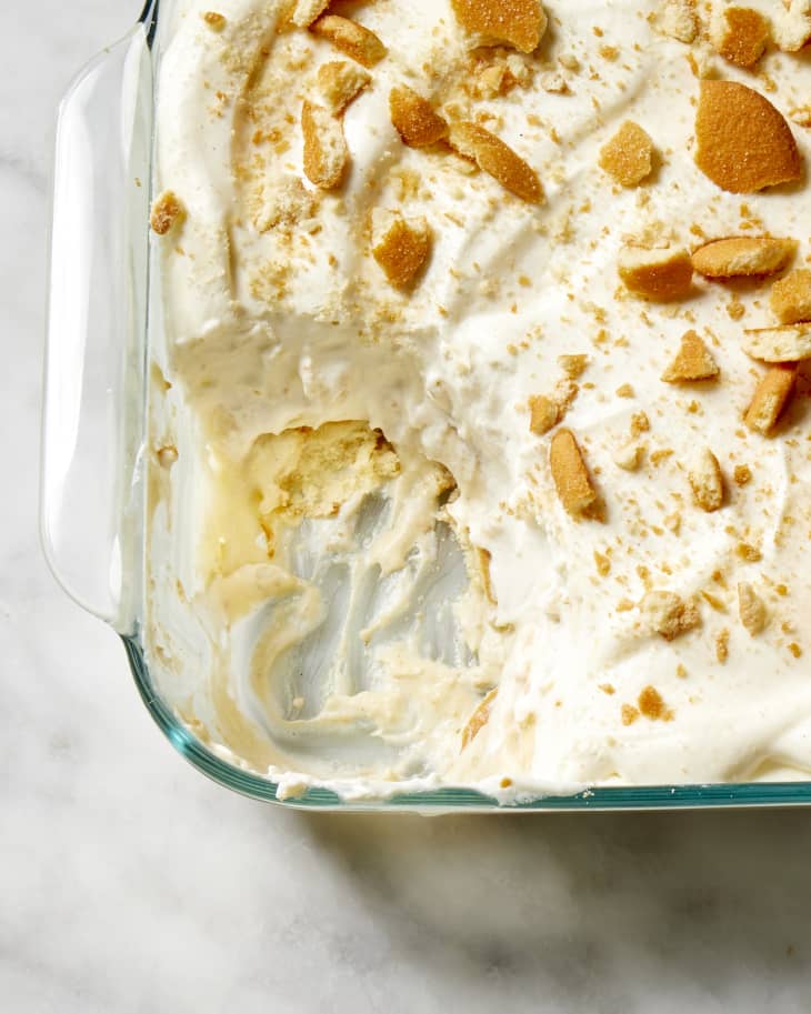 An close up view of Rodney Scott's recipe for banana pudding with a scoop taken out
