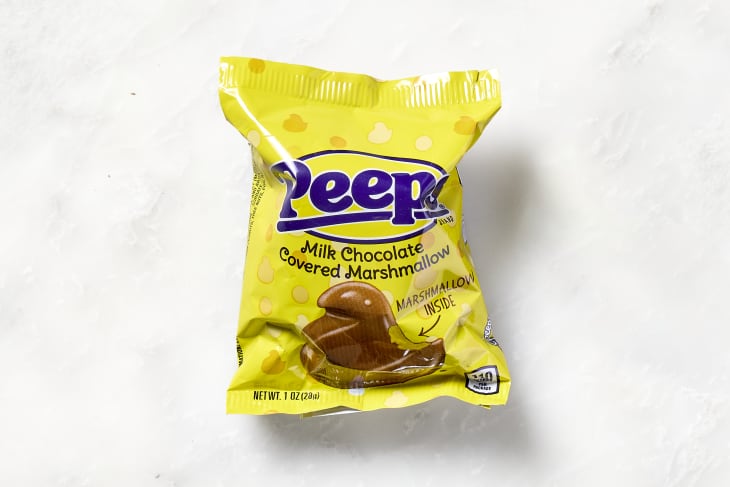shot of a milk chocolate covered peep in the packaging.