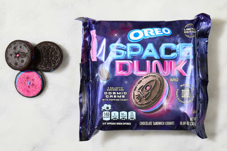 overhead shot of the space dunk flavored oreos with a few cookies laying down next to the box