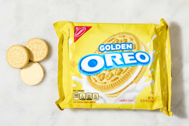 overhead shot of the golden flavored oreos with a few cookies laying down next to the box