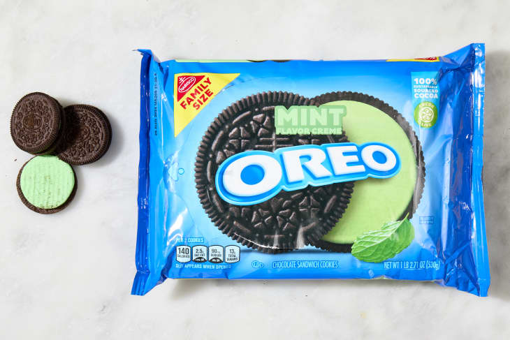 overhead shot of the mint flavored oreos with a few cookies laying down next to the box