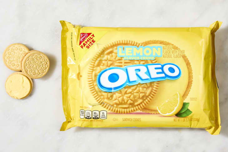 overhead shot of the lemon flavored oreos with a few cookies laying down next to the box