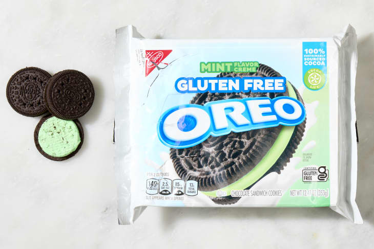 overhead shot of the gluten free mint flavored oreos with a few cookies laying down next to the box