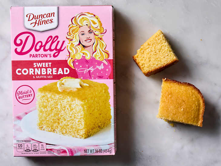 overhead shot of Dolly Parton's sweet cornbread mix, with two pieces of cornbread next to the box