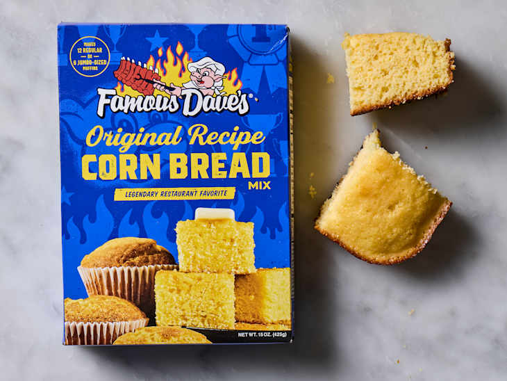 overhead shot of Famous Dave's corn bread baking mix, with two pieces of corn bread laying next to the bag