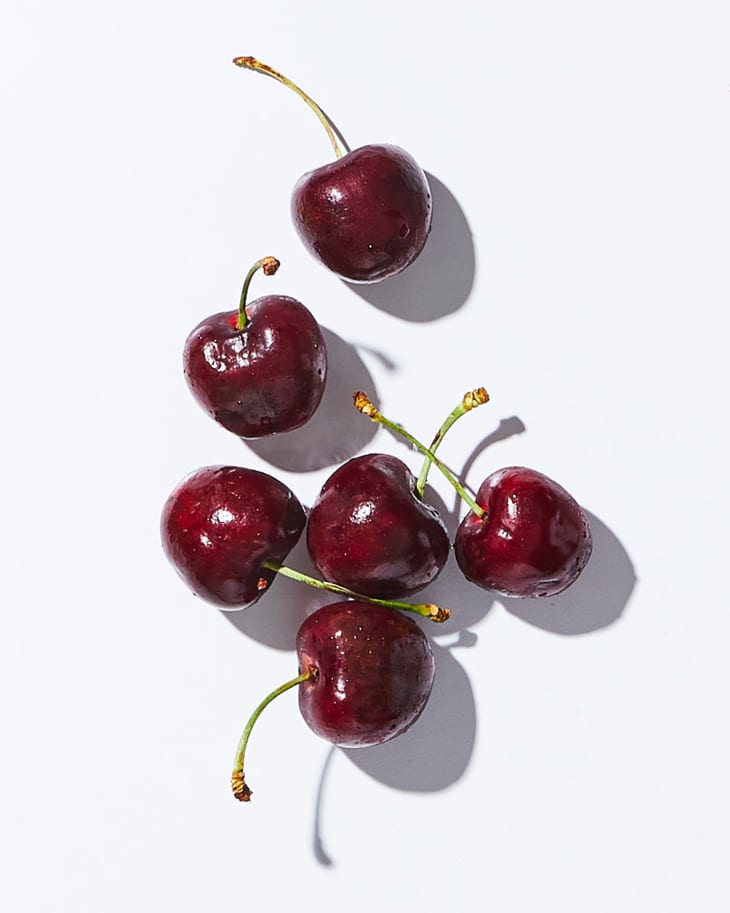 Cherries on a white surface