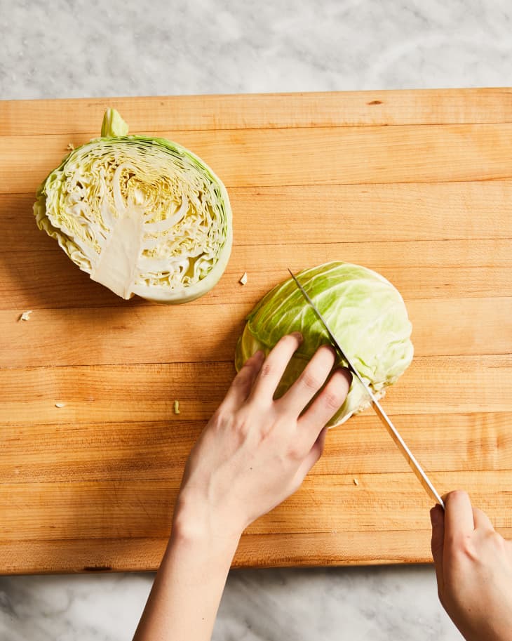Depiction of the instructions in How to Cut and Shred Cabbage with a Knife step 4