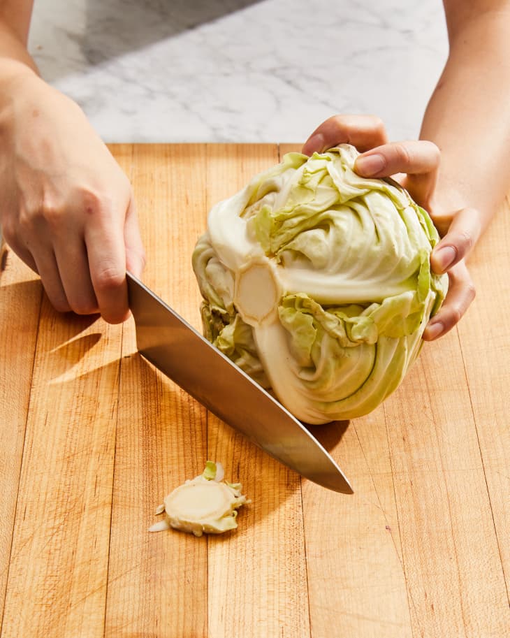 Slicing end off cabbage