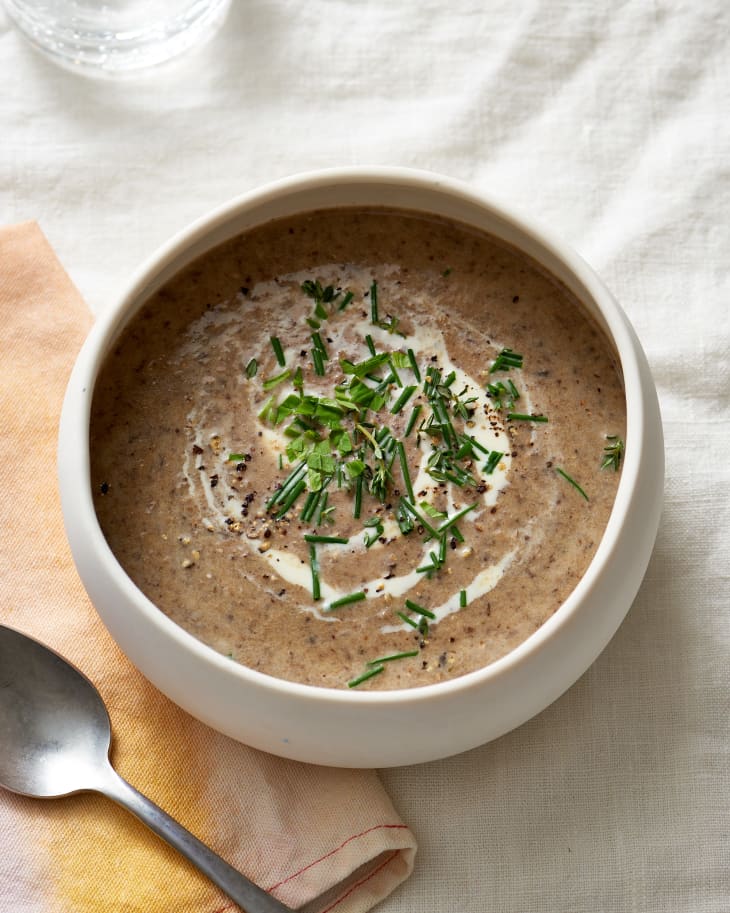 Cream of mushroom soup, cooked in a slow cooker, in a bowl