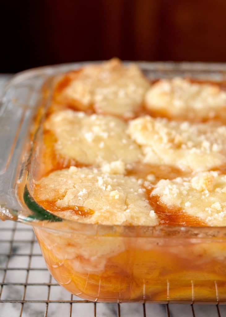 Close up of peach cobbler in a baking dish