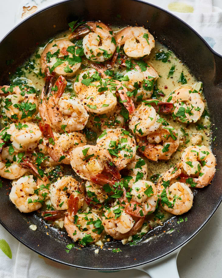 A cast iron pan of garlic butter shrimp