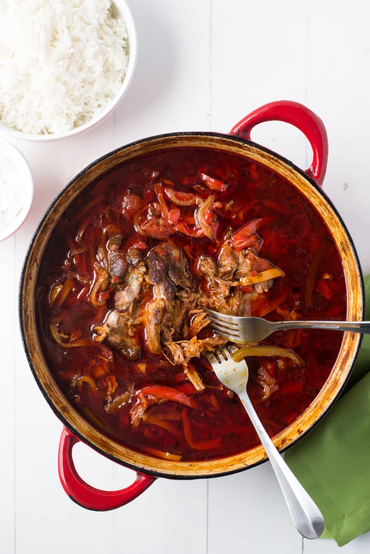 Jamie Oliver’s pork and chile-pepper goulash in a Dutch oven, with two forks in it