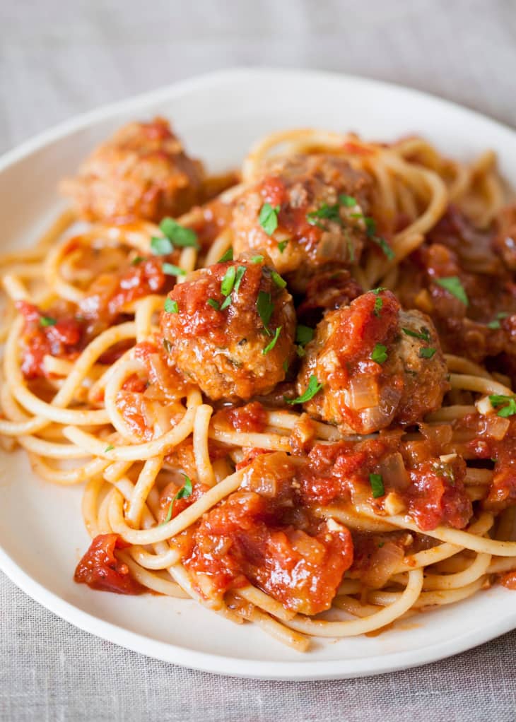 Plate of spaghetti with sauce and meatballs