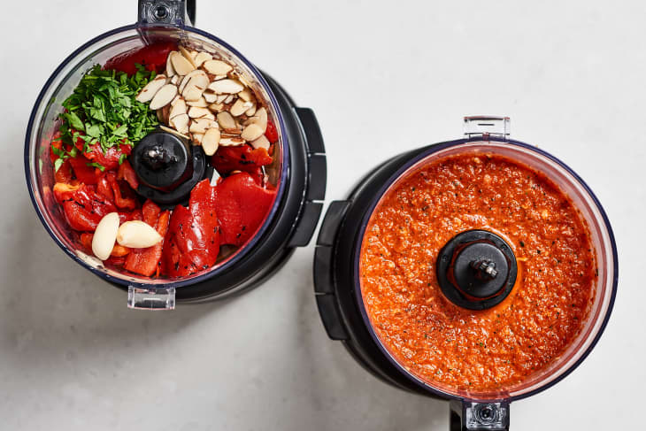 The food processor on the left shows ingredients for the Romesco dip, including roasted red peppers, parsley and sliced almonds, while the food processor on the right shows the Romesco dip after blending the ingredients