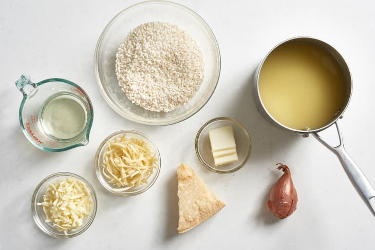 Ingredients for Instant Pot risotto: Arborio rice, butter, shallot, white wine, fontina, mozzarella, Parmesan, and chicken stock