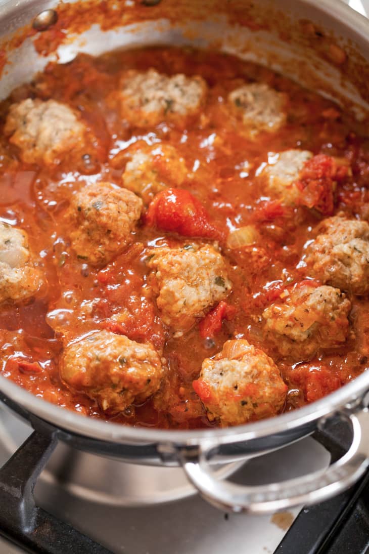 Sauce and meatballs cooking in a pot