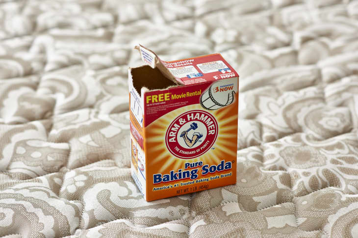 An opened box of Arm & Hammer pure baking soda