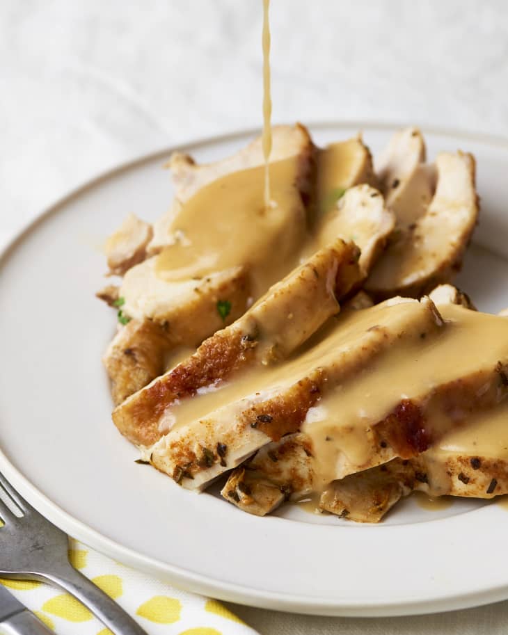 Gravy pouring over slices of turkey