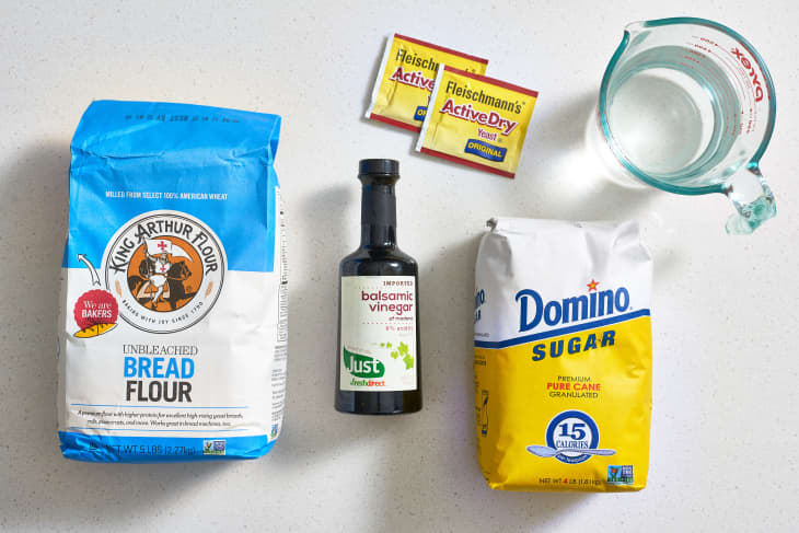 Ingredients for no-time bread, clockwise: yeast, water,  sugar, balsamic vinegar, and flour