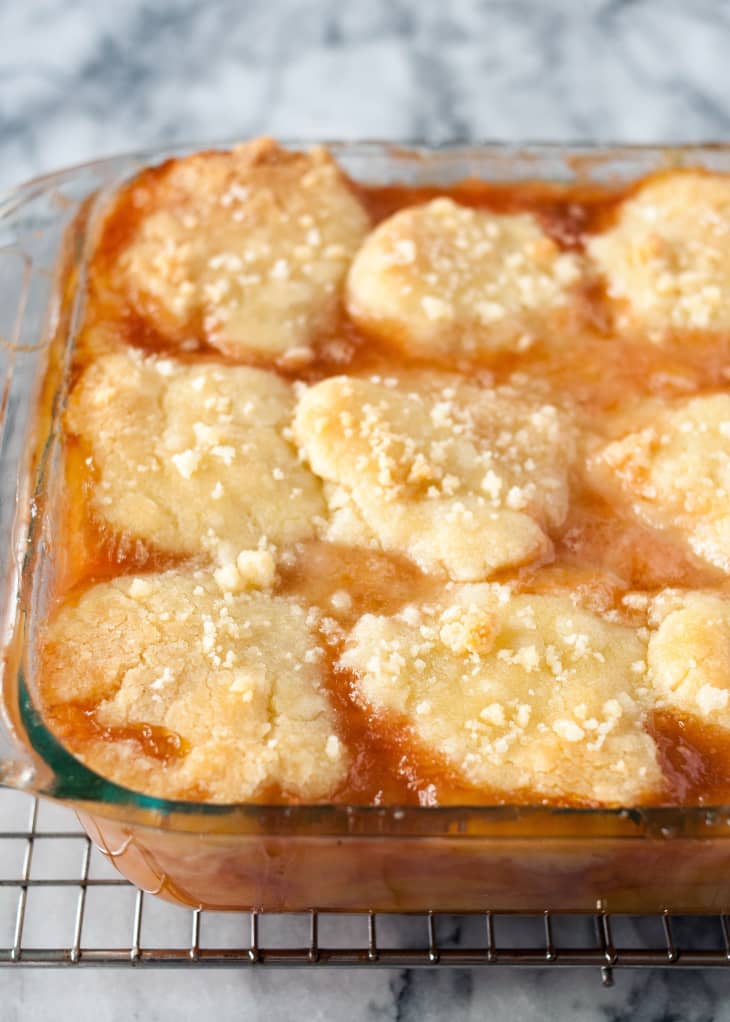 Baking dish filled with peach cobbler