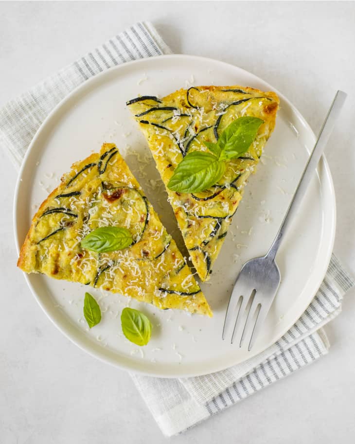2 slices of Scarpaccia (zucchini tart) on plate with fork