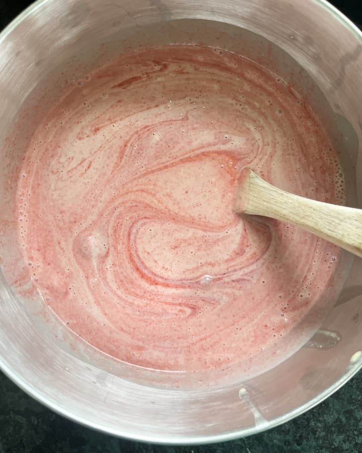 Mixing up ingredients to make strawberry ice cream