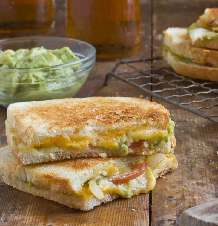 Our Best Grilled Cheese Recipe Cheddar Jack Grilled Cheese with Charred Onions & Guacamole Kitchn
