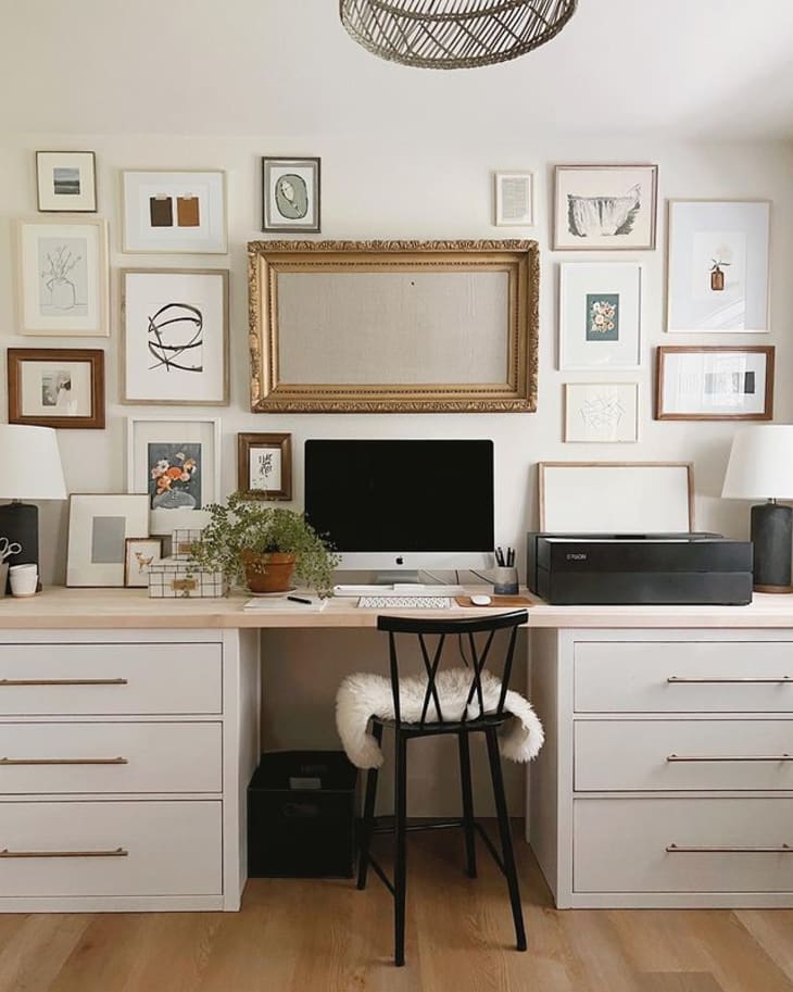 a home office features a large desk made from IKEA HEMNES dresser