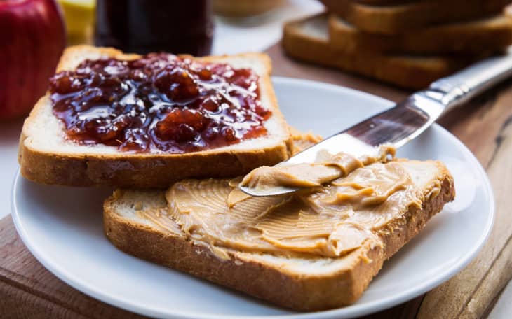 two pieces of bread with peanut butter and jelly on them