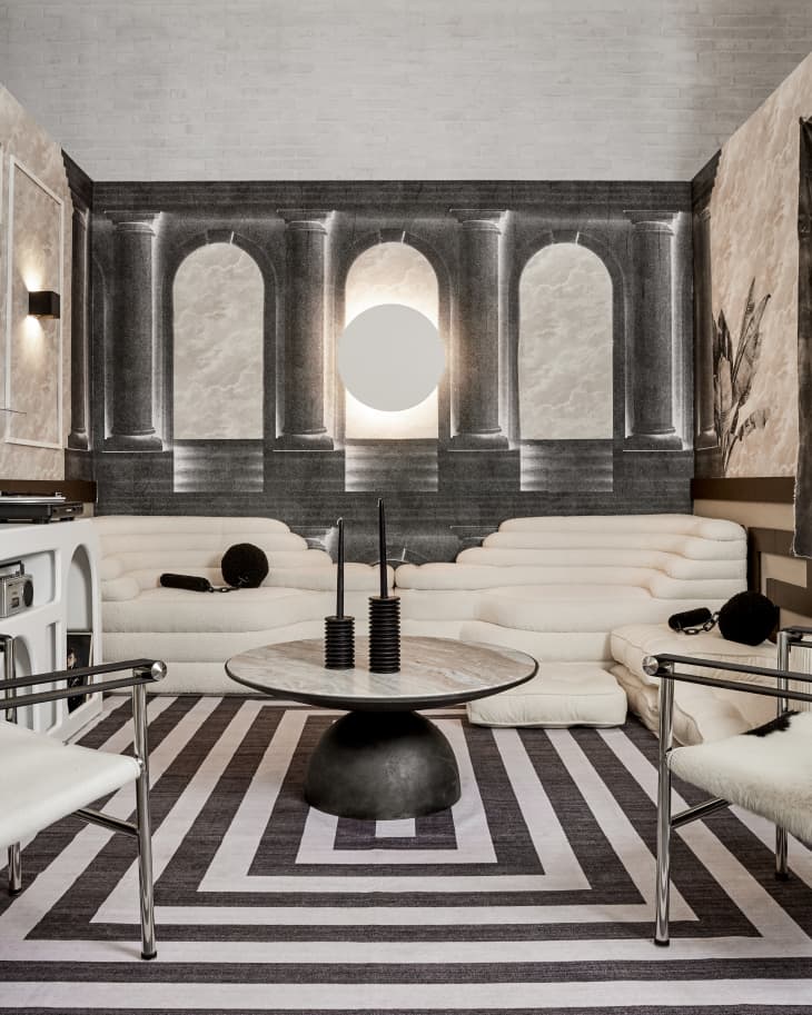 black and white room with futuristic furniture and decor, tic tac toe spay paint on wall