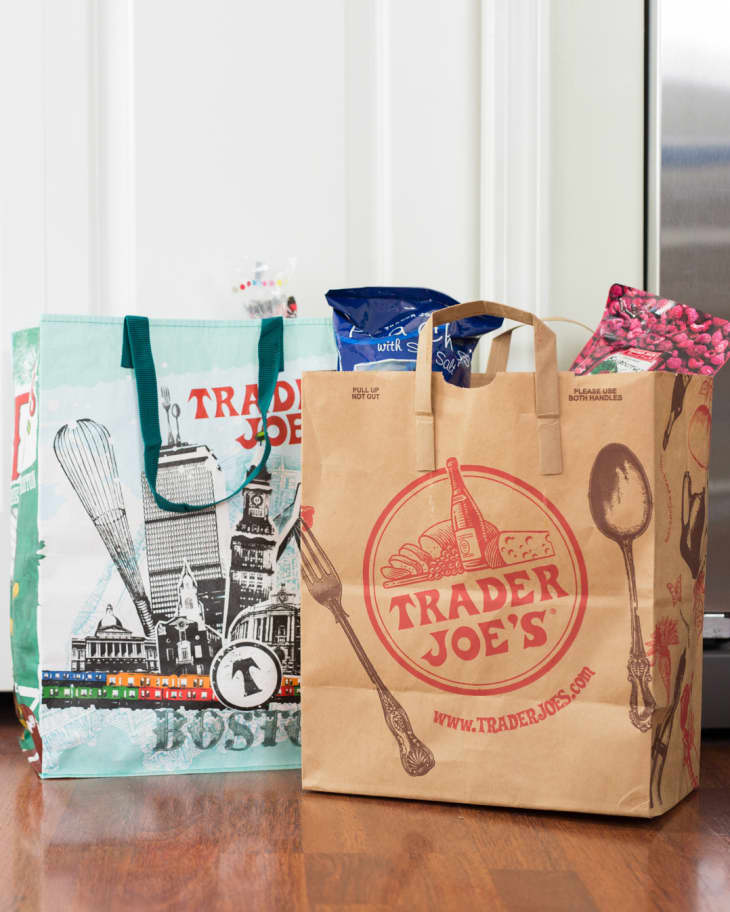 Trader Joe's shopping bags in kitchen.