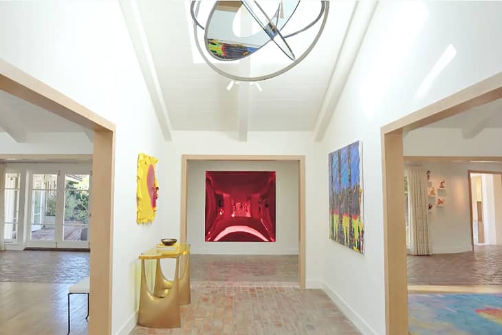Entryway decorated with art inside Jim Carrey's L.A home.