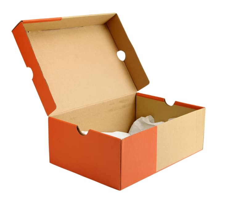 Open empty shoe cardboard box isolated on white background
