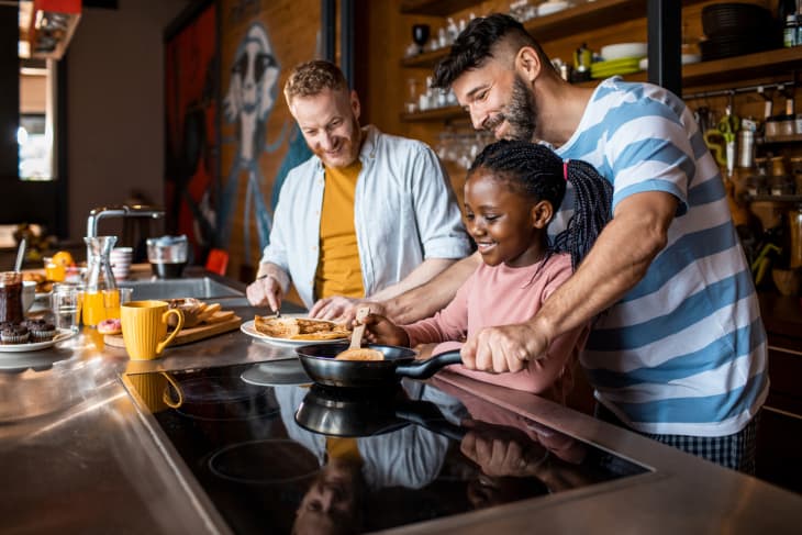 Young family making breakfast