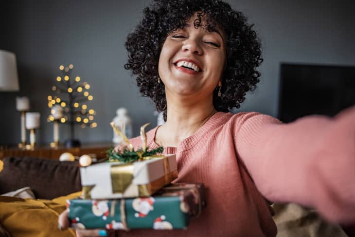 Mature woman at home, celebrating Christmas on a video call