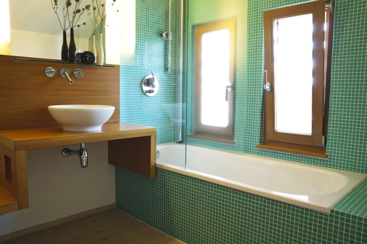 Modern bathroom with green tiles