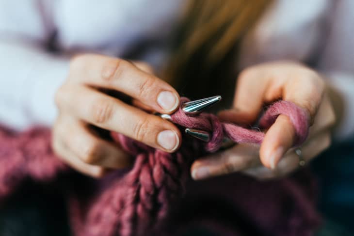 Woman knitting at home