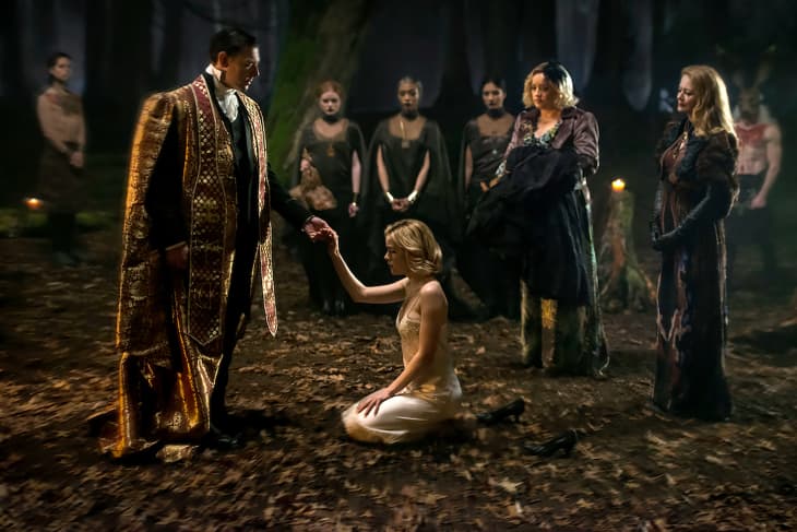 CHILLING ADVENTURES OF SABRINA, (l to r, foreground): Richard Coyle, Kiernan Shipka, Lucy Davis, Miranda Otto in 'Chapter Two: The Dark Baptism', (Season 1, Episode 102, aired October 26, 2018),