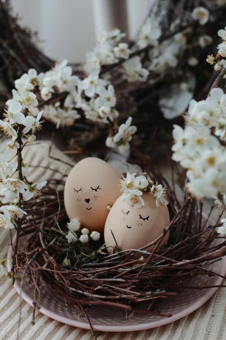 Creative eggs in nest on table