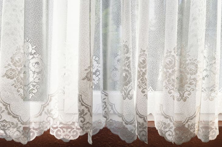 Lace curtains on window